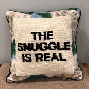 “The Snuggle Is Real” throw pillow